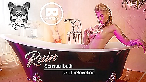 Teen with a tattoo enjoys a hot bath in the shower