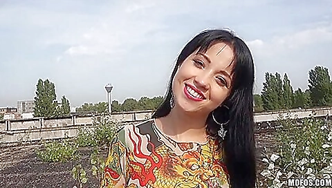 Brunette with a sexy body is fucking her man outdoors