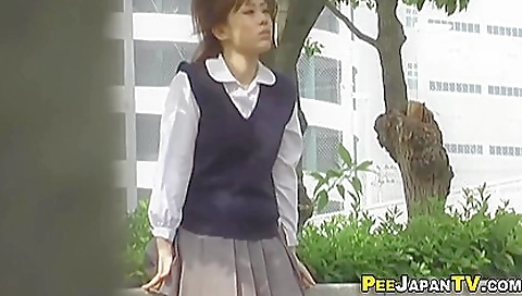 Asian amateur sucks a man and pisses in a mud hole