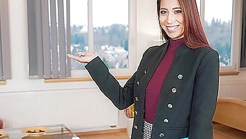 Horny brunette girl with a vibrator is in the kitchen